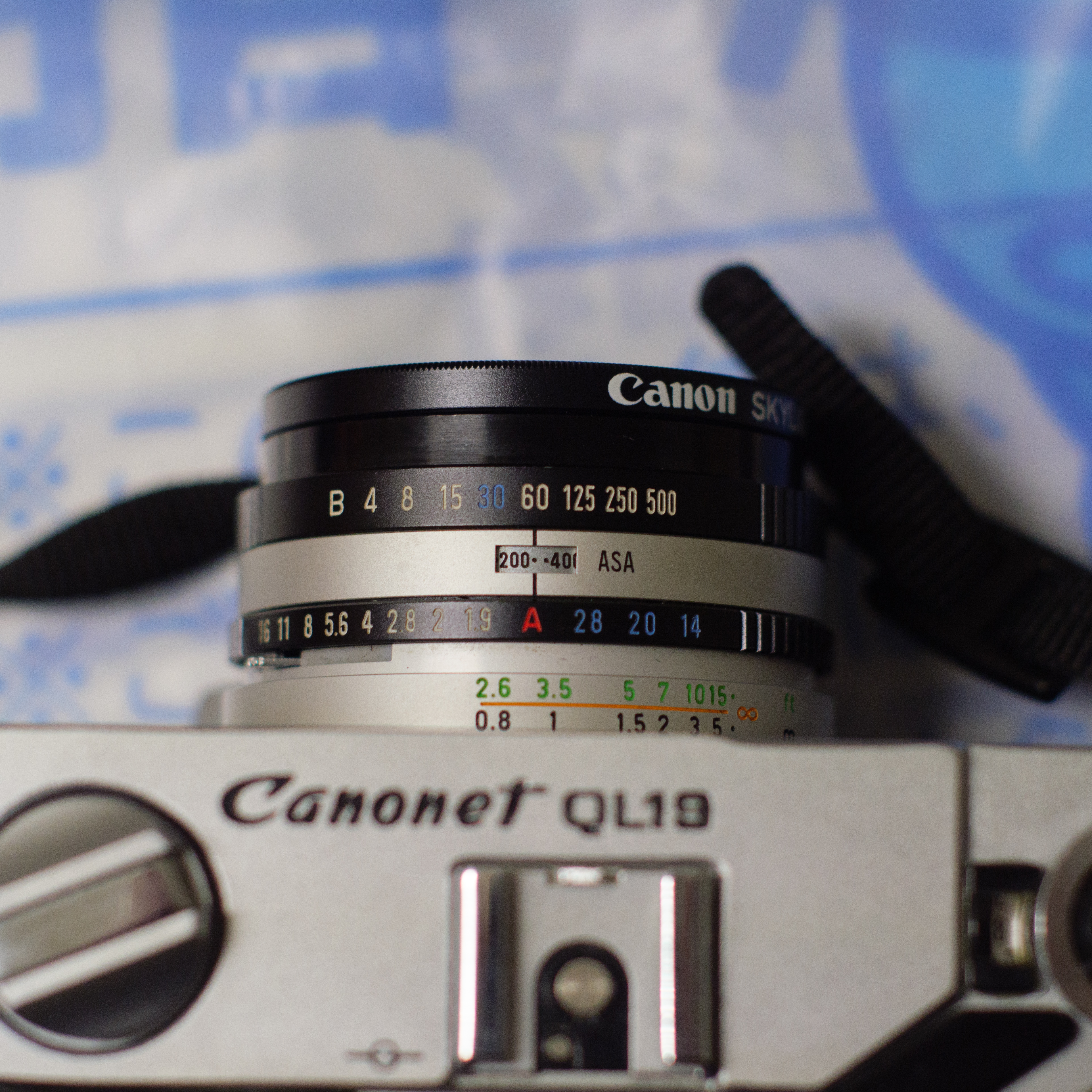 The aperture ring on the Canonet. Setting it to A puts it into shutter speed priority mode, where it automatically chooses the correct aperture for the given shutter speed. Setting into any other location puts it into manual mode
